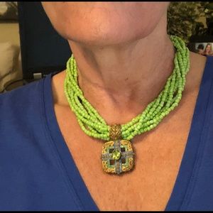 Green necklace with medallion
